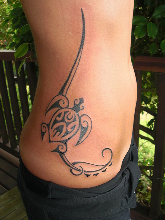 Stephanie's turtle and stylized wave lines accentuate the curves of her torso.