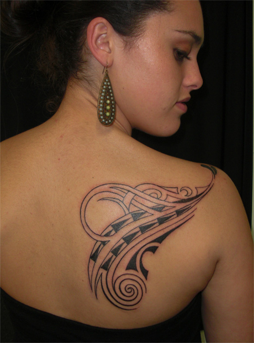Kanani wears a tattoo designed by her father to represent specific family members & priorities within the family history.