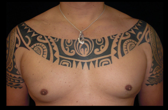 Ray's chest was inspired by both modern and traditional Marquesan tattoo designs.