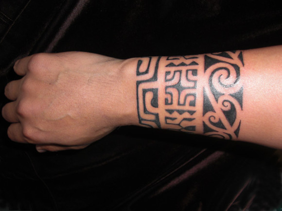 Maori and Marquesan inspired design elements blend in this Polynesian style forearm band.