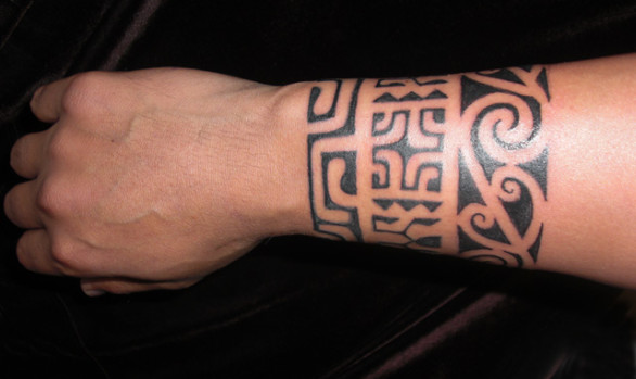 Maori and Marquesan inspired design elements blend in this Polynesian style forearm band.